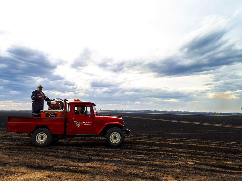 Late Thursday afternoon, a Makana fire vehicle crosses the airfield towards a flare-up west of the army base.