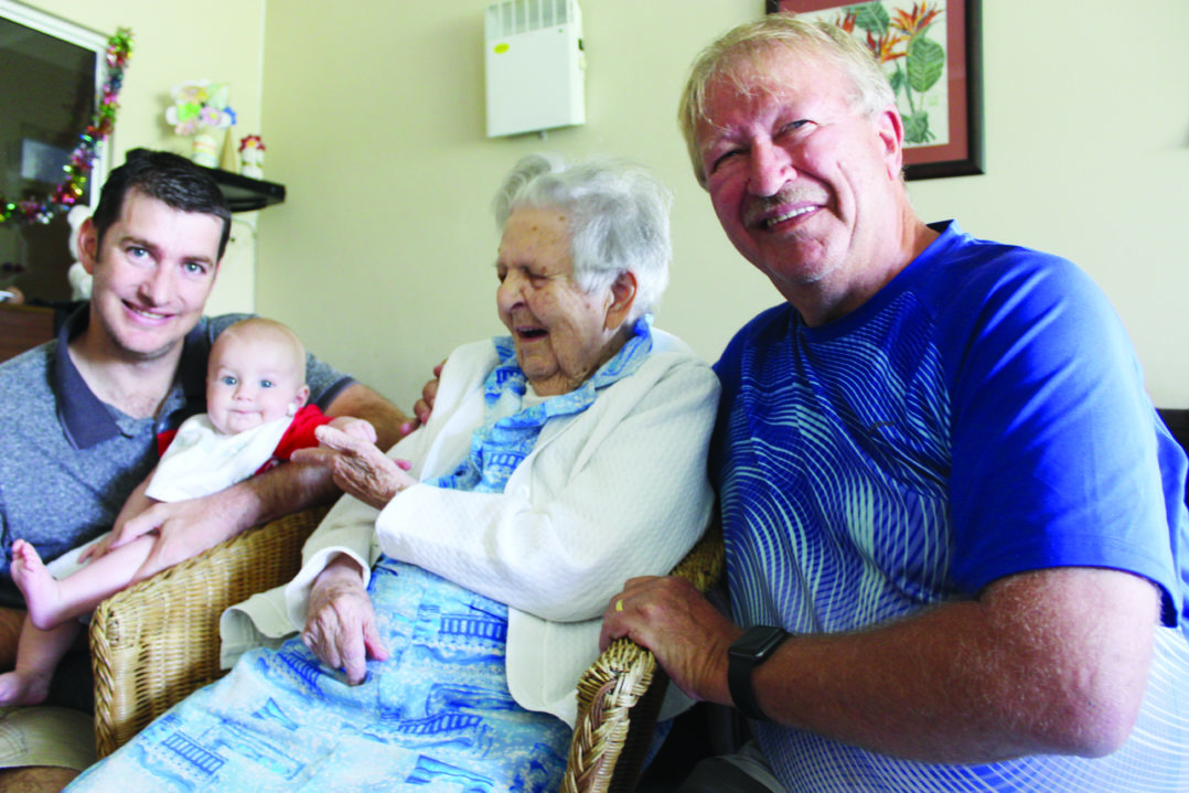 Una Levy smiles at Kyle Levey (5 months) as he remains gripping