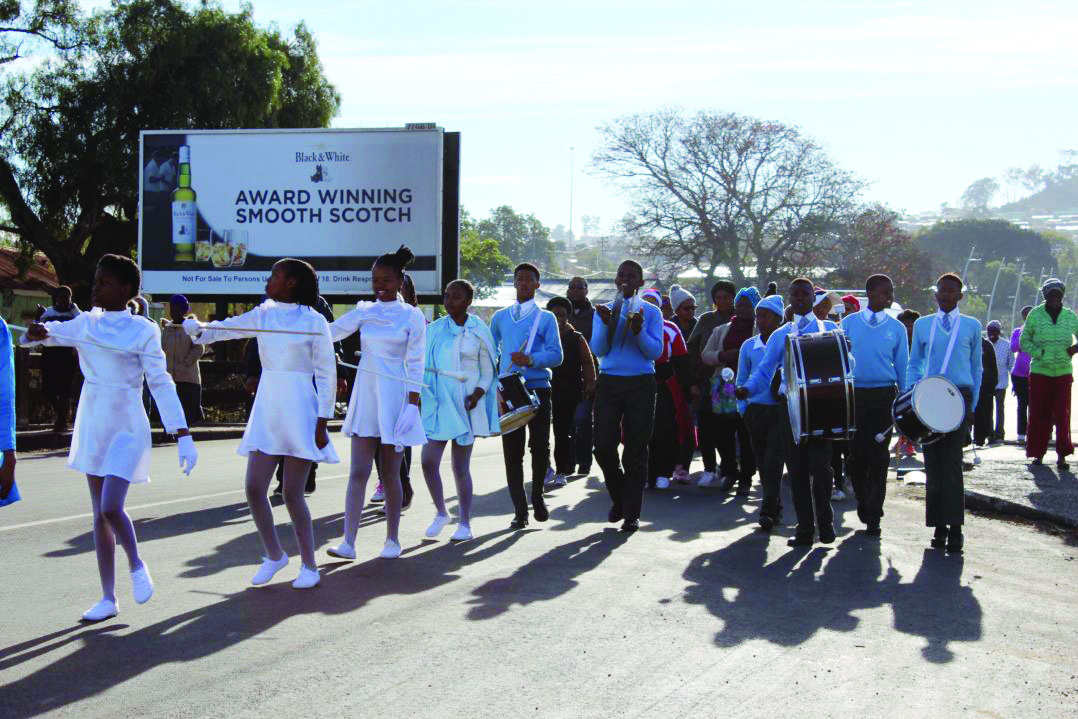 The-Archie-Mboloekwa-marching-band-leads-the-procession-of-women-in-the-walk-towards-Fort-England-on-Thursday-9-August