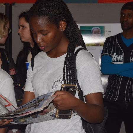 Third year Journalism student Nokuthula Sibiya reads the special Grocott's Education supplement at the Masazaneni Exhibition at the Joza Youth Hub last Friday. Photo: Michelle Banda